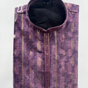A folded purple patterned kurta with a mandarin collar, featuring vertical gold and beige stripes, a central decorative button placket, and a silver metal belt buckle on the side, shown against a plain light gray background.