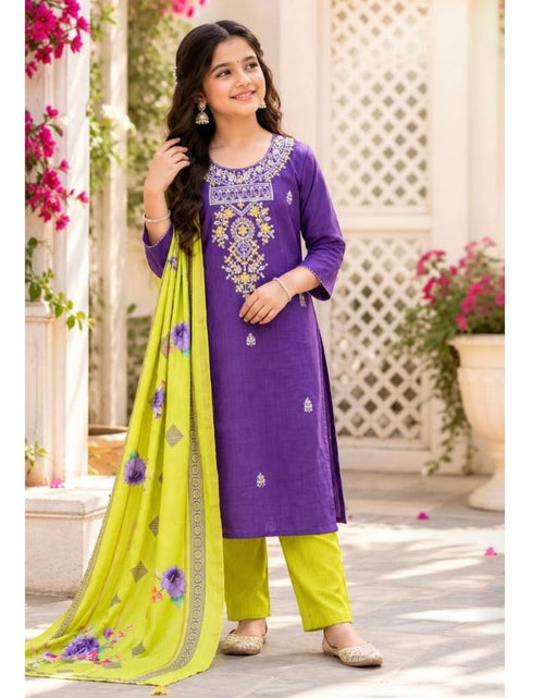 Load image into Gallery viewer, A woman models a purple salwar kameez suit with a bright lime green dupatta and matching lime green trousers, set against a traditional courtyard background.
