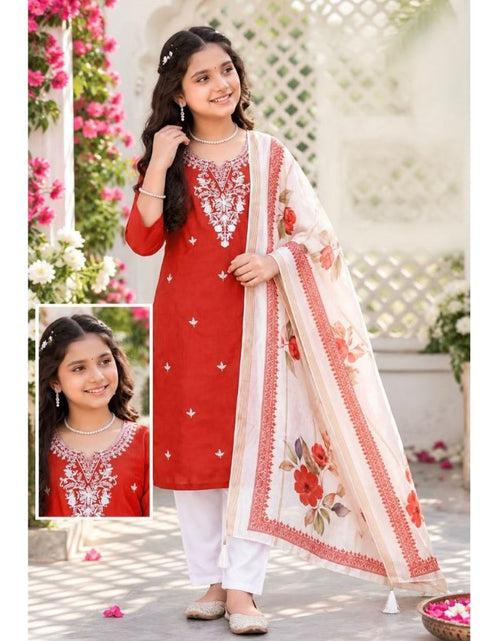 Load image into Gallery viewer, A young girl modeling a red kurta set with white pants and a white dupatta featuring red floral prints and gold embroidery. The image includes a small inset close-up of the kurta's embroidered neckline.
