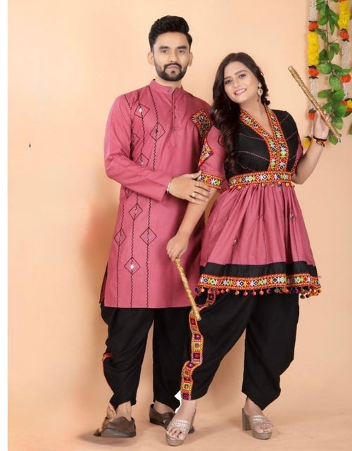 Load image into Gallery viewer, A man and a woman modeling traditional Indian ethnic Navratri couple matching wear. The man wears a dusty pink embroidered kurta with black pants, and the woman wears a matching dusty pink and black kurta with ornate gold and red embroidery, paired with black pants.
