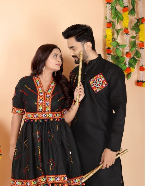 Load image into Gallery viewer, A couple posing in traditional Indian ethnic Navratri wear. The woman wears a black kurta with colorful geometric embroidery, and the man wears a matching black kurta with a similar embroidered patch on the chest.
