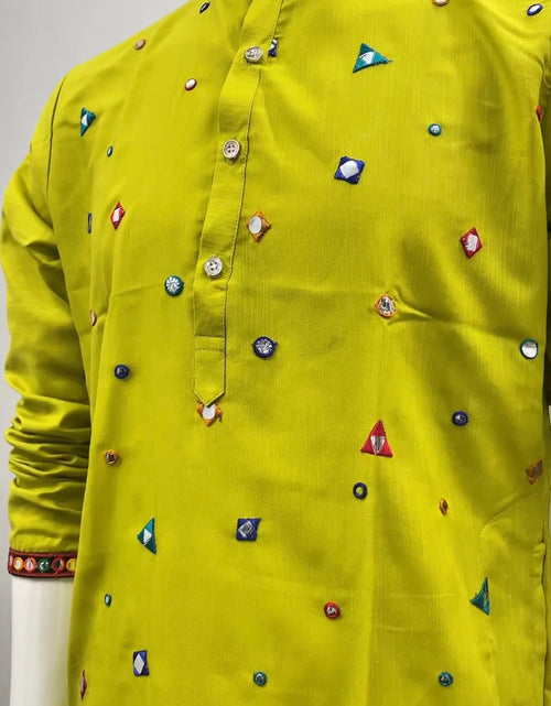 Load image into Gallery viewer, A bright yellow-green kurta displayed on a mannequin, featuring a mandarin collar, buttoned front placket, and scattered colorful embroidered geometric motifs.

