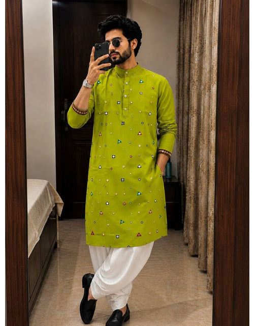 Load image into Gallery viewer, A man takes a mirror selfie wearing a bright lime green kurta with small colorful geometric prints, paired with white trousers and black shoes in an indoor setting.
