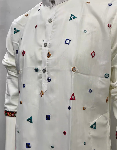 Load image into Gallery viewer, A white long-sleeve kurta with colorful geometric embroidered motifs, displayed on a mannequin torso against a plain light gray background.
