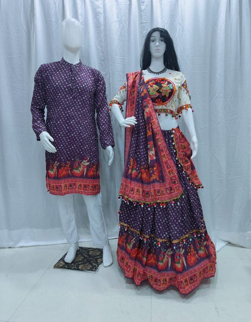 Load image into Gallery viewer, A traditional Indian ethnic wear set displayed on mannequins, featuring a matching men's kurta and women's lehenga choli in deep purple with red and orange patterns.
