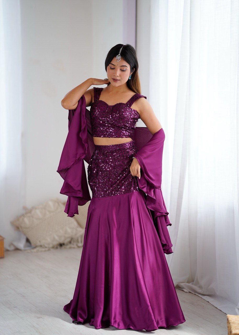 party dress skirt and blouse LOOK 1 A high-neck, sleeveless blouse paired with a dramatic, elongated skirt both traced with shimmering paillette at the hem. Fluid yet structured, it's a silhouette that stretches elegance into something bold,
